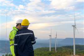 Workers at wind farm (Image: Adobe Stock)