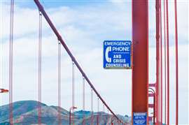 Suicide prevention signs on Golden Gate Bridge (Image: Adobe Stock)