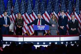 Surrounded by family members and supporters, Donald Trump makes his acceptance speech at his Election Night Watch Party at the Palm Beach County Convention Center after being elected the 47th President of the United States November 5, 2024.